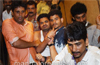 Mangaluru : Youth climbs  atop building  at Hampankatta; threatens to end life
